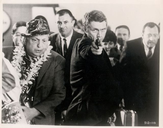 Steve McQueen (as Frank Bullitt) in a shootout at the airport.